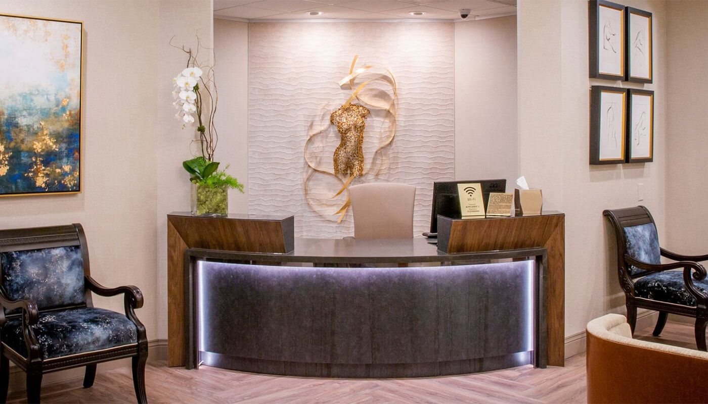 Modern reception area with artwork and seating.