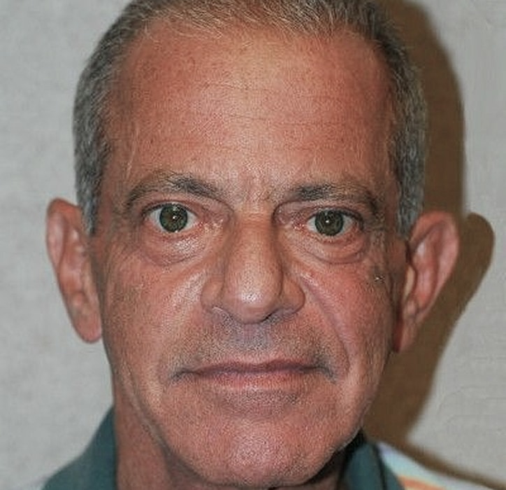 Close-up of a middle-aged man’s face.