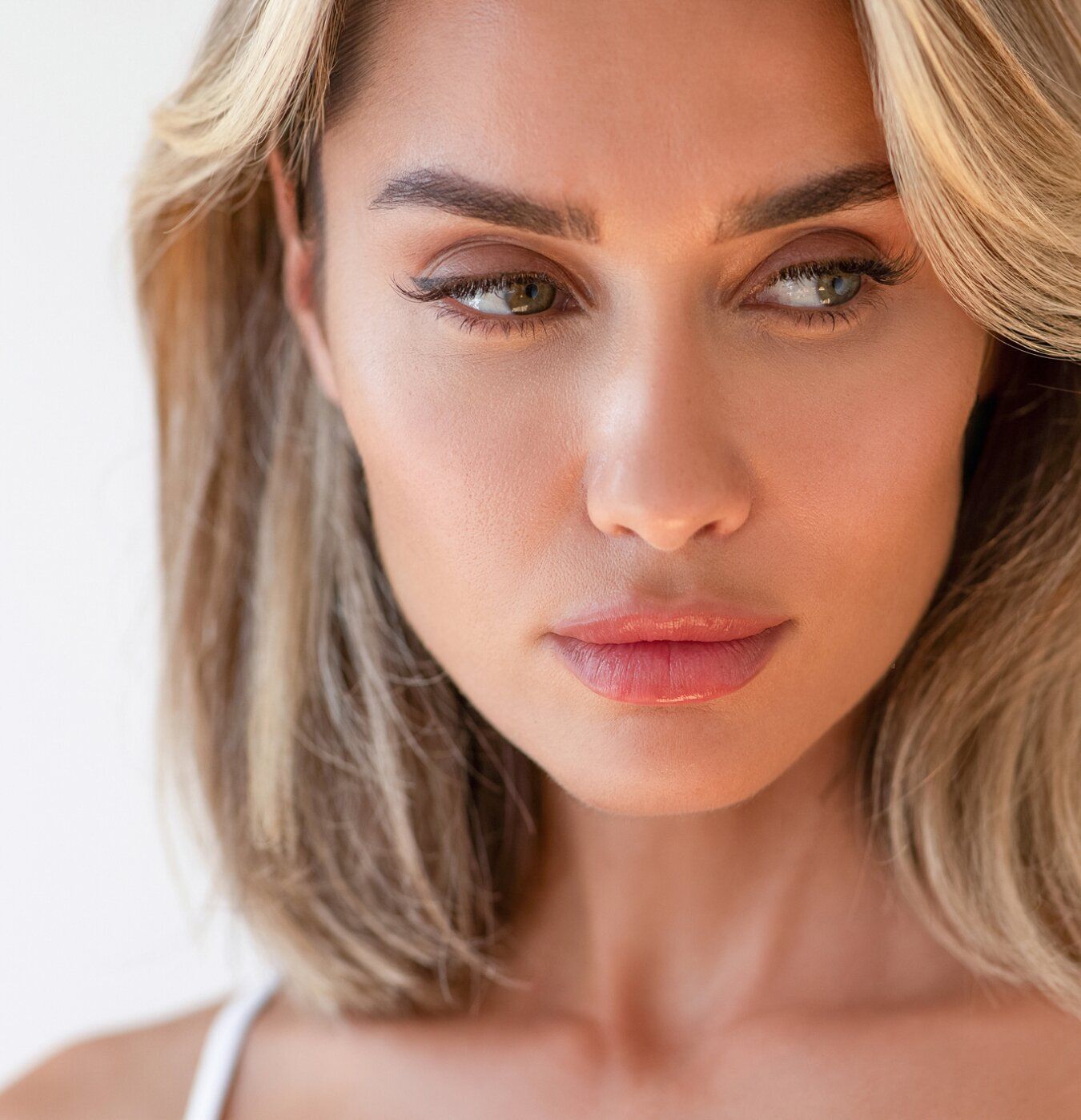 Close-up portrait of a contemplative woman.