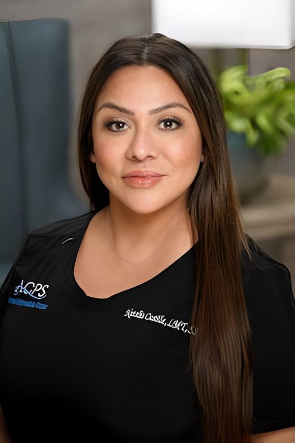 Professional woman in a black shirt smiling