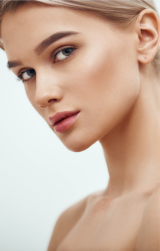Close-up of woman's face with natural makeup.