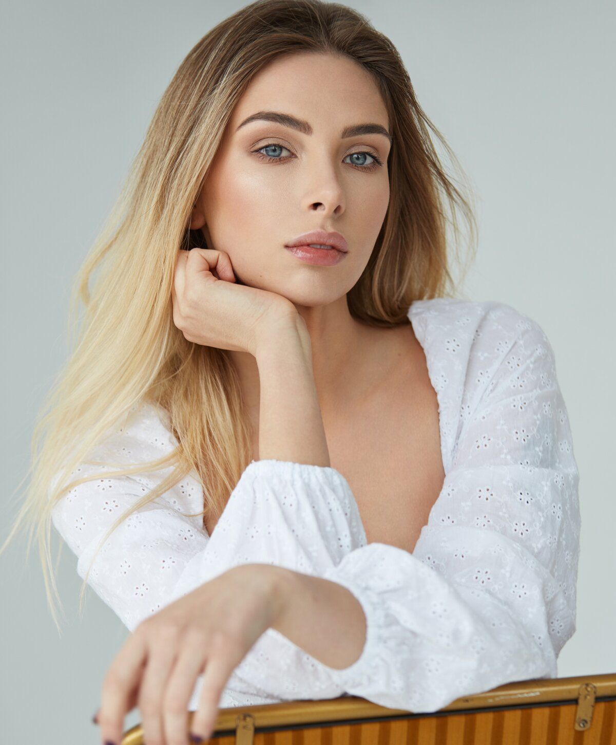 Model with light hair and natural makeup.