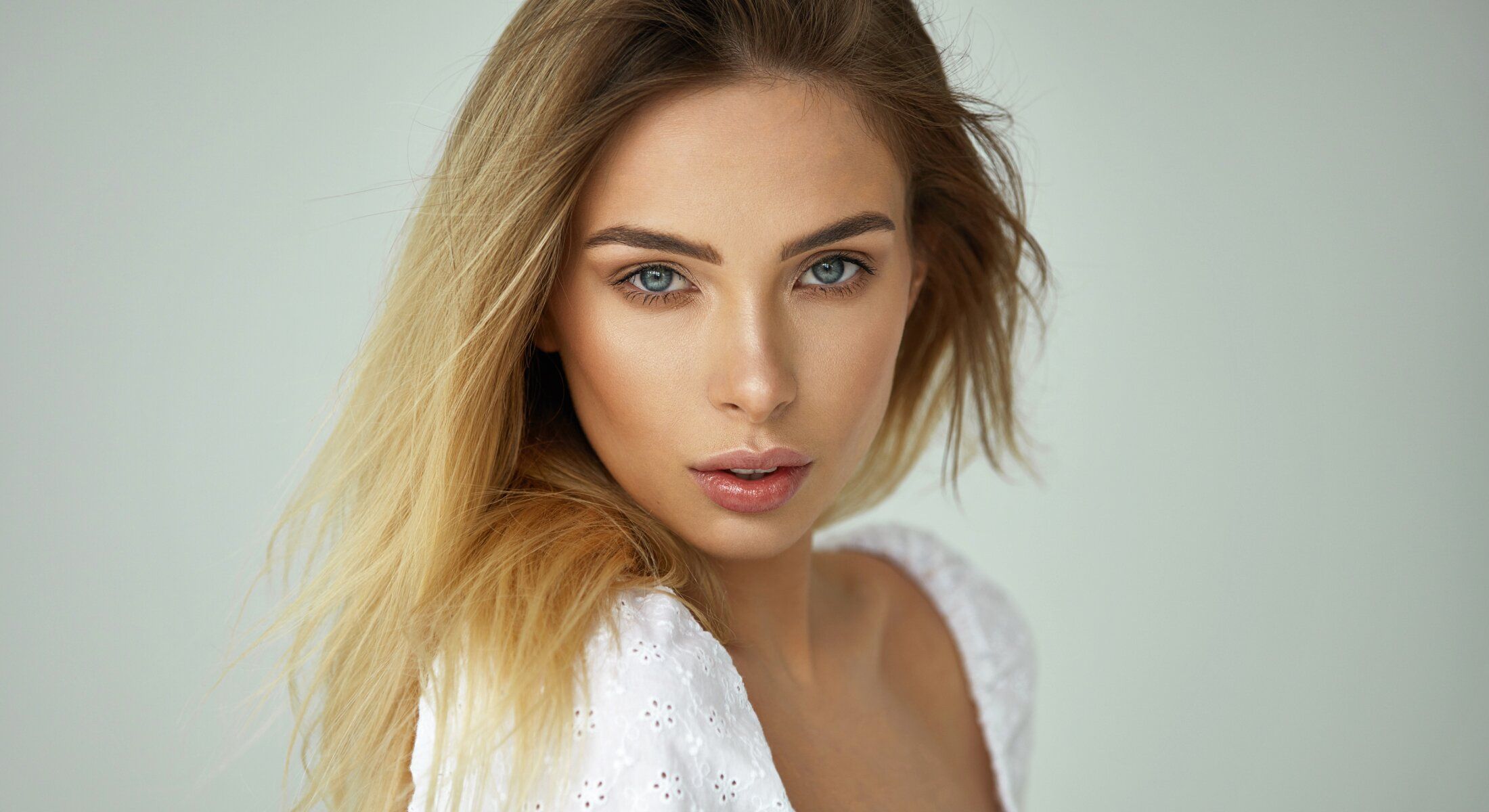 Beautiful woman with long hair and blue eyes.