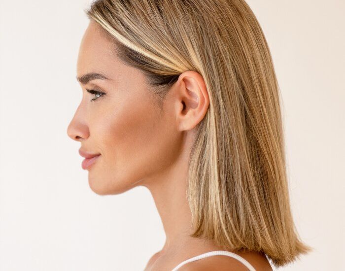 Profile shot of woman with long blonde hair.