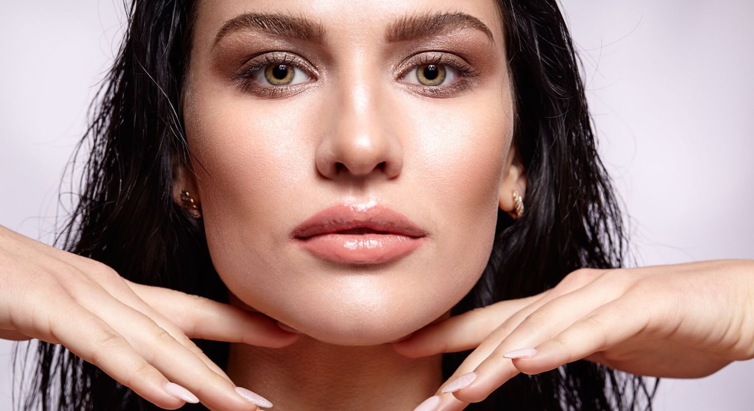 Close-up of a woman with elegant makeup.