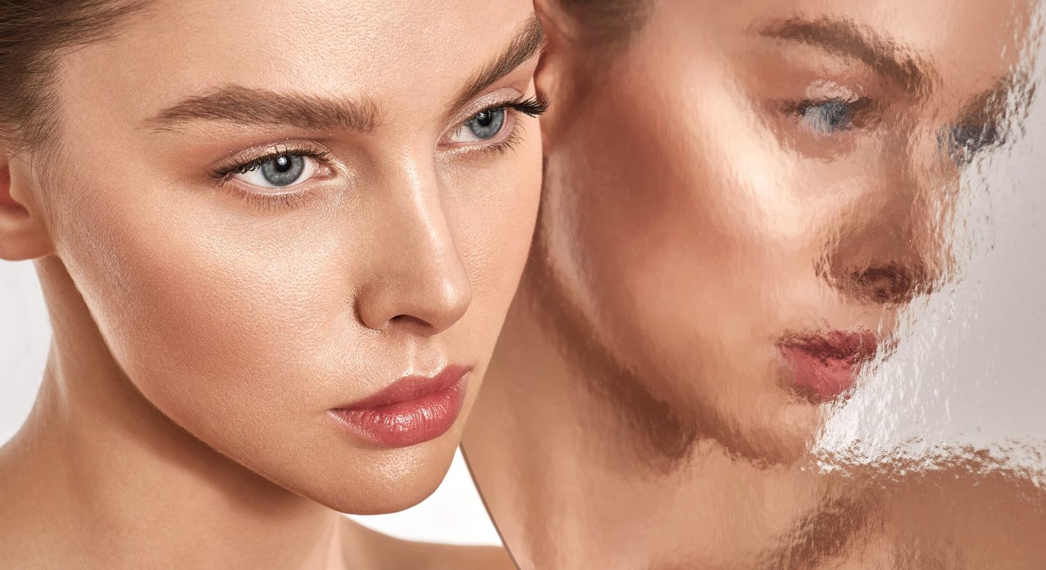 Close-up of woman's face with reflections.